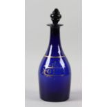 A BRISTOL BLUE DECANTER AND STOPPER, the mallet shaped body painted in gilt with 'GIN' in