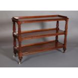 A VICTORIAN MAHOGANY THREE TIER DUMB WAITER having a three quarter gallery on tapered and lobed