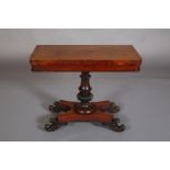 A VICTORIAN MAHOGANY CARD TABLE, having a rectangular fold-over top lined with baise, on an inverted