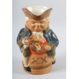 A ROYAL DOULTON LAMBETH STONEWARE TOBY JUG, the figure sitting astride a barrel marked XX, glazed in
