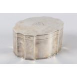 A GEORGE V SILVER BISCUIT BOX, Goldsmiths & Silversmiths Co, London 1918, of oval serpentine