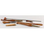 A COLLECTION OF 19TH CENTURY HARDWOOD AND BRASS MOUNTED LEATHER WORKING TOOLS, two with agate heads,