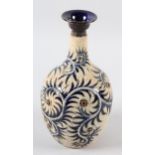 A DOULTON LAMBETH STONEWARE VASE by George Tinworth, the ovoid body incised and beaded with