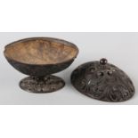 AN 18TH CENTURY CARVED COCONUT SHELL PEDESTAL DISH AND COVER, finely pierced and worked with