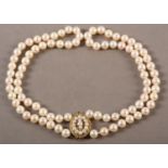 CULTURED PEARL CHOKER NECKLACE in two strands of approximately 7mm pearls fastened with a 9ct gold