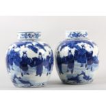 A PAIR OF CHINESE BLUE AND WHITE GINGER JARS AND COVERS, 19th century, painted with figures
