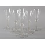 A SET OF SIX LIEGE BALUSTROID WINE GLASSES, the funnel bowls with tight writhen moulding, the stem