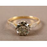 A SINGLE STONE DIAMOND RING IN 18CT YELLOW AND WHITE GOLD c.1950, the round brilliant stone AGI