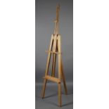 An artist's easel in pale oak, 150cm high