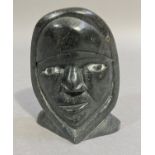 Inuit Carving - Inuit Face by Josephie Nalukturuk 1983, black stone with white eye detail, 13cm