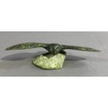 Inuit Carving - Large bird on a rock by Annie Qimirpik 1983, dark green carved bird with wings out