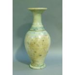 A studio pottery baluster vase with everted rim, the raku glaze tinted from duck egg blue to