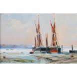ARR Malcolm Winter (b.1943), Thames Barges, moored, low tide, oil on gesso panel, signed to lower