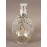 A late Victorian silver mounted Haig & Haig whisky flask, having a flat disc stopper, plain neck,