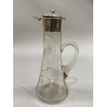 An Edwardian star etched silver mounted cut glass claret jug of tapered cylindrical form,