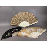 Three late 19th century/early 20th century fans, the first with black gauze and machine lace leaf,
