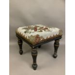 A mid-19th century Berlin woolwork and beaded salon stool, with turned wood legs, painted a dark