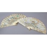 An early 20th century summer fan, the cream gauze leaf painted with daisies and roses with yellow