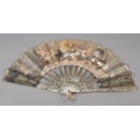 A medieval banquet: a good mother of pearl fan, the monture silvered and gilded, showing the