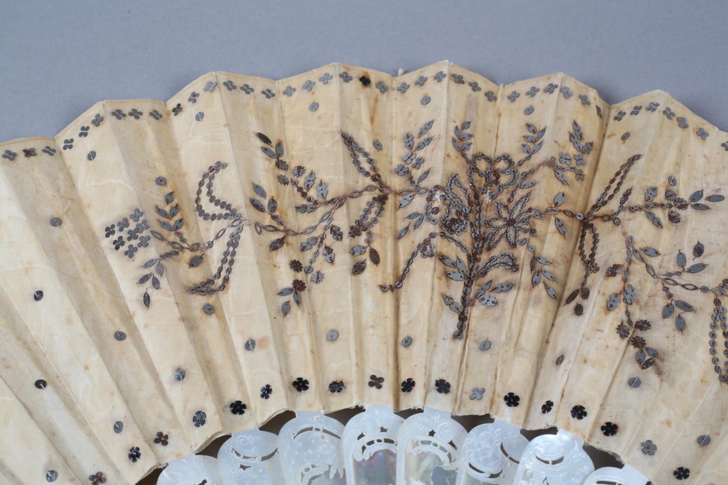 A c.1880’s mother of pearl fan with very elaborate carving, the guards pierced then applied with - Image 3 of 6