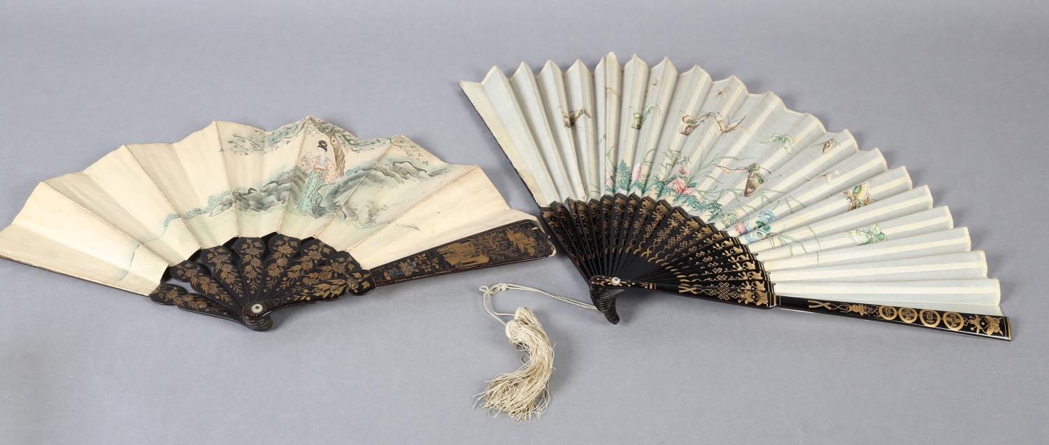 Two 19th century Chinese fans, Qing dynasty, the first quite large, the cream gauze leaf painted