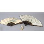 Two 19th century Chinese fans, Qing dynasty, the first quite large, the cream gauze leaf painted
