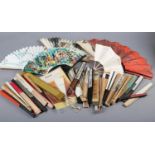 A large selection of 20th century folding fans advertising airlines and other transport, to