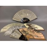 A collection of 20th century Chinese fans, to include two examples with cream gauze leaves,