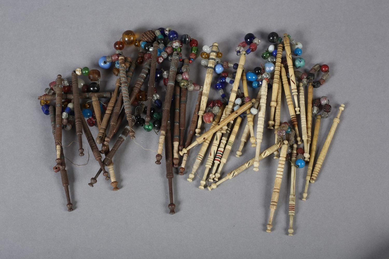 Lace bobbins, a quantity, a mix of turned wood with and without spangles, several with wire