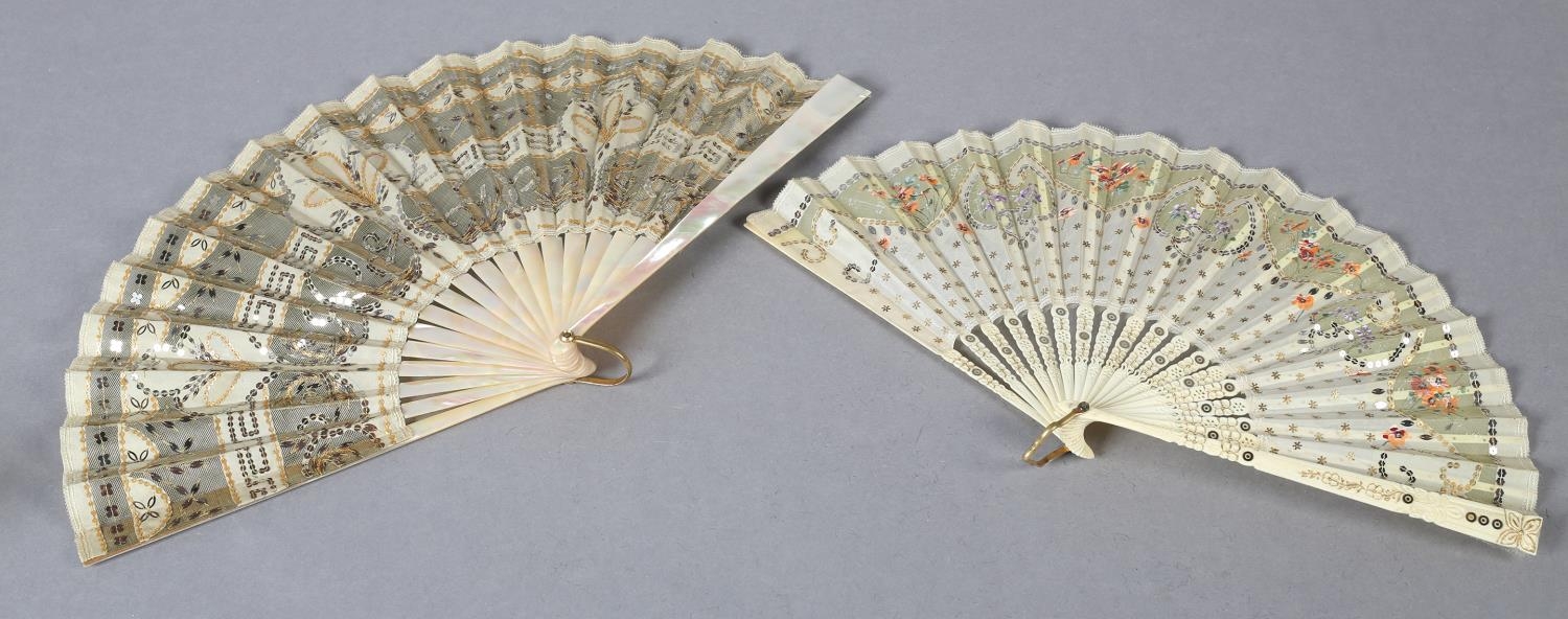 A good c.1900 light pink mother of pearl fan, the leaf of gold lamé overlaid with cream silk, cut