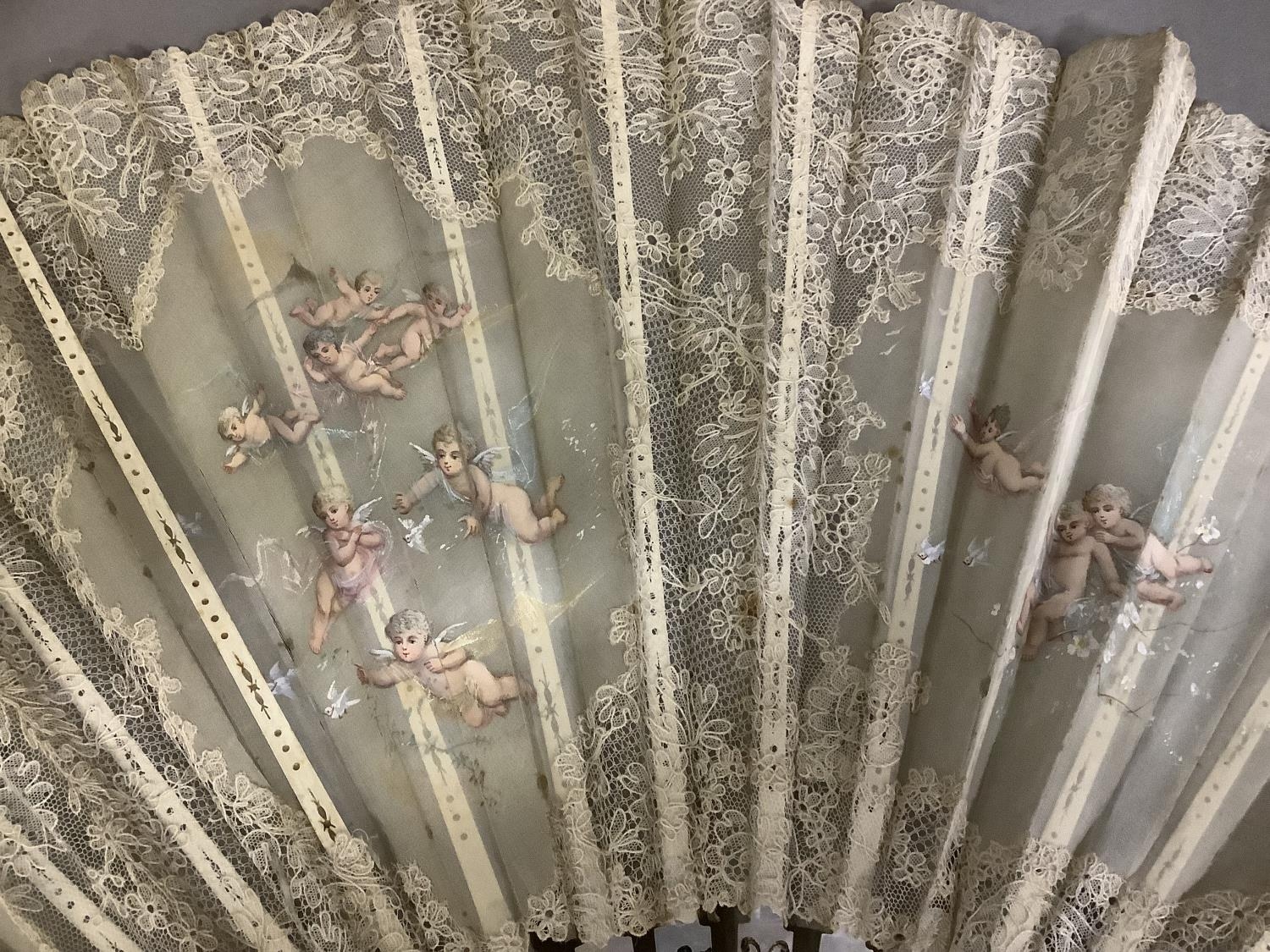 Fans: one late 19th century with gilded mother of pearl monture and painted gauze leaf; a smaller - Image 5 of 5