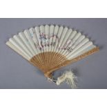 A 20th century Chinese carved sandalwood fan, the white cotton gauze leaf embroidered in pastel