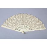 A Maltese lace fan worked in silk in three horizontal panels, quite a detailed design with seven