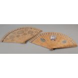 Two late 18th century wood brisé fans, the first with 28 inner sticks and two guards, rounded