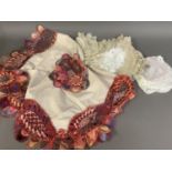 A selection of lace mats, early 20th century and earlier, mainly handmade, some in sets, to