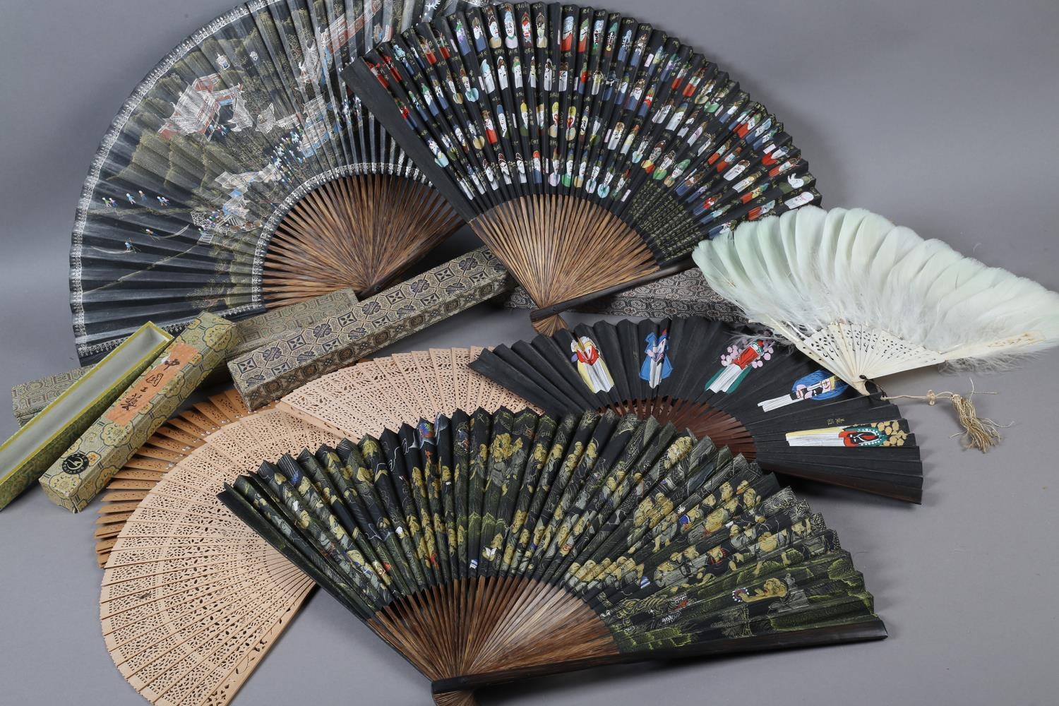 The Peking Opera: Eight 20th century Chinese fans, five of which are contained in brocade covered