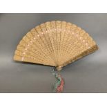 A 19th century Canton Chinese Qing Dynasty carved sandalwood brisé fan, the guards deeply carved,