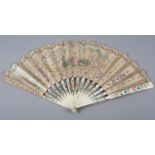 An interesting mid to late 18th century carved and pierced bone fan with double paper leaf,