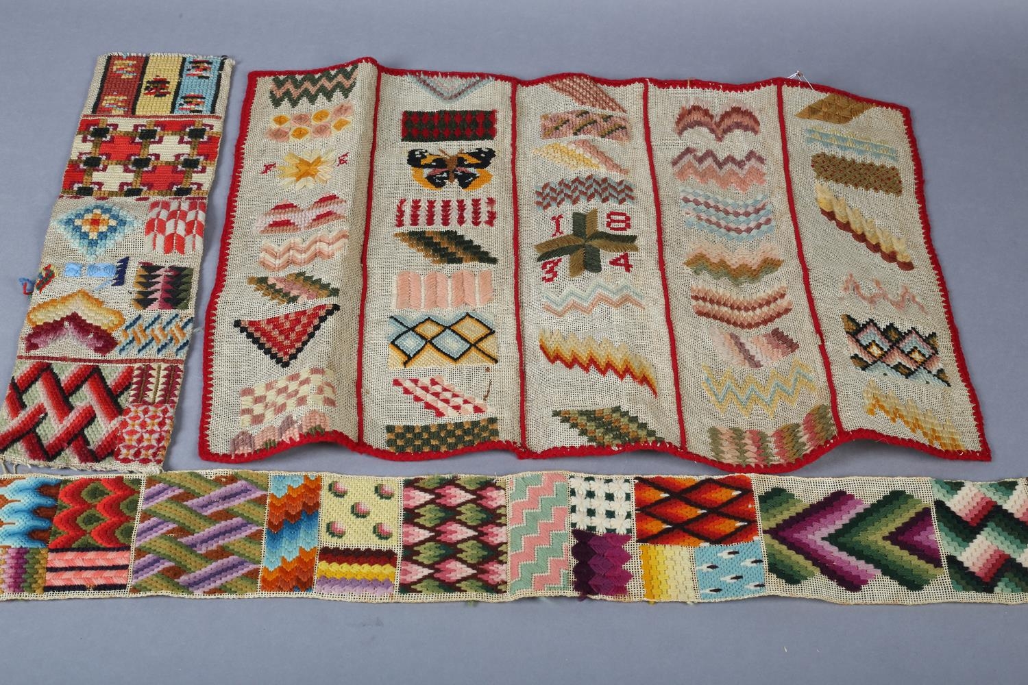 Berlin woolwork: spot samplers, on canvas, one dated 1834, the first in rectangular form, divided