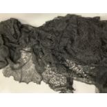 Antique lace: a 19th century black rectangular machine lace shawl with floral design, approx.