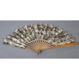 A large late 1890’s wood fan with double paper leaf, the simple monture with varnish guards, the