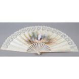 c.1890’s, a large and showy painted silk fan, the cream silk edged in cream machine lace, the