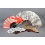 Japan: Four Japanese fans to include a large folding fan with knotted cord decoration to both
