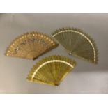 Three early 19th century brisé fans, Jane Austen period, the first with original card tube, the