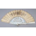 A c.1880’s mother of pearl fan with very elaborate carving, the guards pierced then applied with