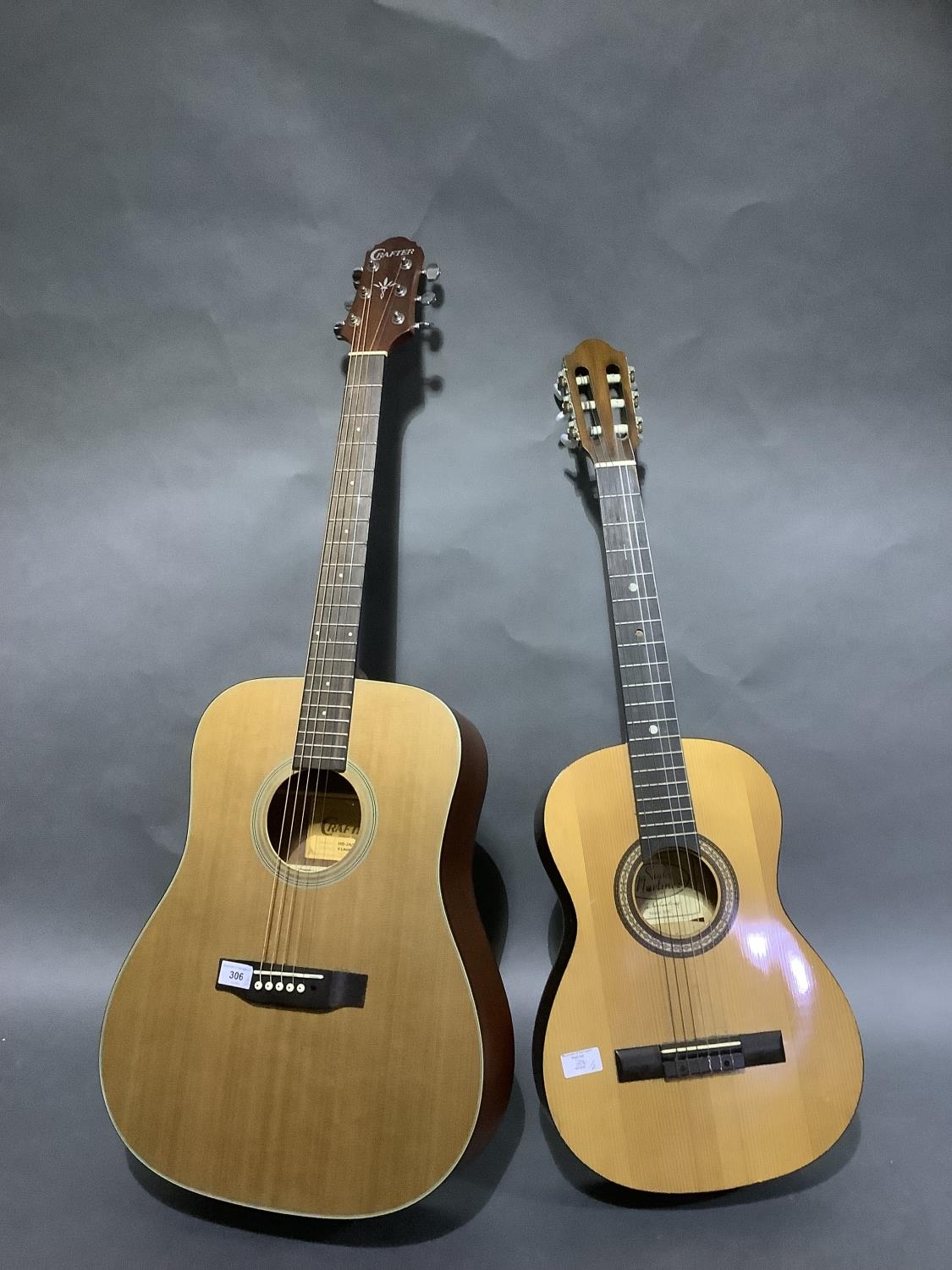 A Crafter silver series acoustic guitar and a smaller acoustic guitar by Santos Martinez model SM2