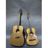 A Crafter silver series acoustic guitar and a smaller acoustic guitar by Santos Martinez model SM2