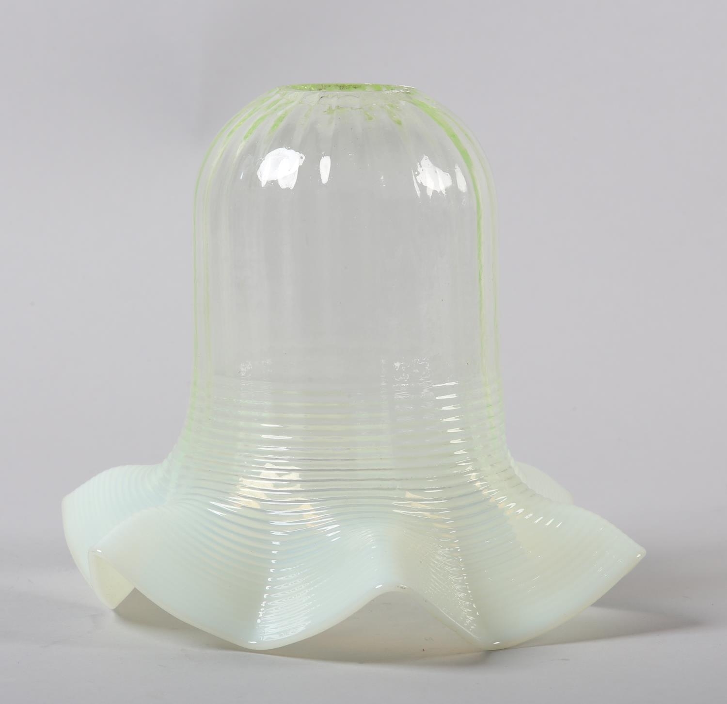 A late 19th century vaseline glass light shade with vertically banded and folded rim, 17cm