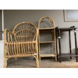 A wicker chair and three tier shelf stand and a small side table with galleried top