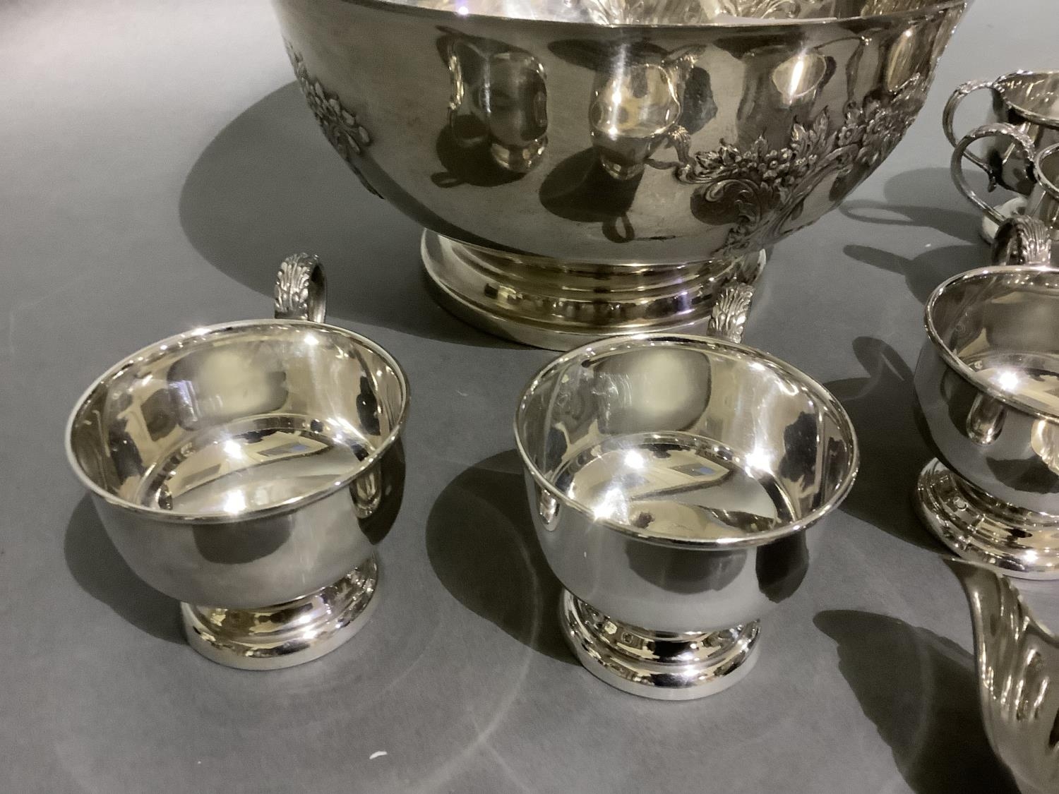 A good silver plated punch bowl with six cups and ladle, embossed with flowers and blind cartouche, - Image 3 of 5
